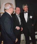 President Emeritus Howard Johnson (left), alumnus Kenan Sahin (center) and Dean Philip Khoury of the School of Humanities, Arts, and Social Sciences share a laugh at the school's 50th anniversary gala.
