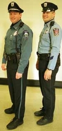 MIT Campus Police Officer Willard J. Boulter III (left) sports the department's new uniform, side by side with Officer Peter M. McTague, who's still wearing the old one.