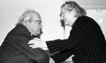 At a 1997 party honoring his 80th birthday, Institute Professor Emeritus Herman Feshbach is greeted by human rights activist Yelena Bonner, who told guests of the party how Professor Feshbach had helped smuggle the work of her husband, Andrei Sakharov, out of the Soviet Union. Professor Feshbach "wasn't worried about the KGB -- he only worried about his wife finding out," she said.