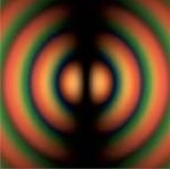 Rings of color generated by a computer simulate interference fringes observed in an experiment with light.