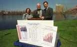 The EPA issued its annual report card on the quality of the Charles River last Friday at Magazine Beach in Cambridge. Left to right: MIT's Jamie Keith and Paul Parravano, and the EPA's Ira Leighton show the river's grade -- a B.