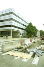 Portions of Ames Street have been torn up for utility work on the Media Lab addition, one of several projects on campus.
