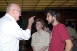 MIT Professor of Mathematics Alar Toomre (left) regales University of Cambridge students Adam Steventon (center) and Daniel Abramson at a brunch given in honor of their arrival for a year's study at MIT.