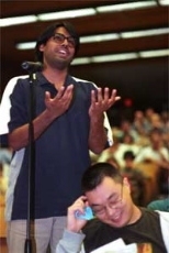 Mechanical engineering graduate student Arvind Narayanaswamy (left) addresses the panel at the first of a series of teach-ins organized by the School of Humanities, Arts and Social Sciences in response to the terrorist attacks.