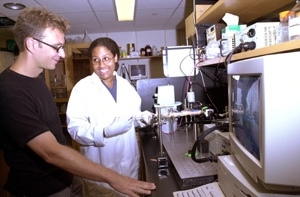 Professor Martin Polz of civil and environmental engineering and graduate student Janelle Thompson analyze water samples in a CDCE machine.