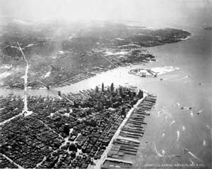 The Manhattan Bridge (left) and the Brooklyn Bridge link New York's two largest boroughs. The photograph of lower Manhattan was taken from about 3,000 feet in 1936.