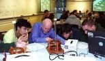 Professor of Physics John W. Belcher (second from left) surveys an experiment in the new interactive TEAL classroom being done by (left to right) freshman Bernardo Zacka, mechanical engineering sophomore Matthew Socks and mathematics sophomore John Gonzalez.