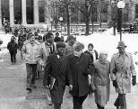 Paul Gray (first row, second from left), one of the winners of this year's        MLK Leadership Award, walks in a procession during the 1984 celebration        of Dr. Martin Luther King Jr. On Gray's right is keynote speaker John        R. Bryant, pastor of St. Paul's AME Church in Cambridge.