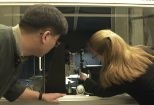 The new NanoMechanical Technology Laboratory is equipped with state-of-the-art machines for the study of atomic and molecular scale materials. Graduate students Yoonjoon Choi (left) and Krystyn Van Vliet of materials science and engineering work with a nanoindenter that can probe and measure the properties of materials' surfaces.