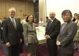 President Charles M. Vest, Barbara Picower, Jeffry Picower and Professor Susumu Tonegawa at last week's announcement of the Picower Foundation's gift of $50 million to establish the Picower Center for Learning and Memory at MIT. An architect's early design model for the new center can be seen on the table behind them.