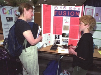 Parent Lise Foss talks with Jonathan Ottinger, a student at the Longfellow School.