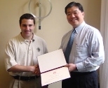 Associate Dean of Engineering Dick Yue (right) congratulates the Henry Ford Award recipient, Ian Parrish