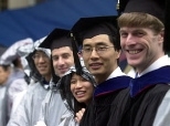 Graduates remain cheery despite the drenching they got at Commencement.