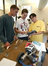 Left to right: Julien Barrier of France, MIT's Martin Jonikas  of the United States and Alexandre Takeshi Ushima of Brazil collaborate on building  a robot from scratch using a tablet PC as part of the International Design Contest.