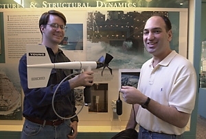 Ocean engineering graduate student Joshua Wilson (left) and Associate Professor Nicholas Makris display a hydrophone that can be used to record sound associated with high winds.