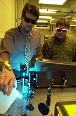 Professor Michael Rubner (left), director of the Center for Materials Science and Engineering, and project technician Tim McClure check the laser in the Raman Spectrometer before setting up an experiment. The spectrometer is part of the center's shared experimental facilities, funded by a $22.2 million NSF grant.