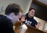 Senior Patrick Nichols (right) makes a point during a recent debate as sophomore Benjamin Hebert listens in the foreground.