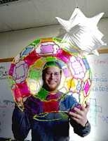 Erik Demaine, an assistant professor of EECS, shows off some of his origami and other creations.