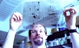 Professor Michael Yaffee surveys a gel in his lab at the Center for Cancer Research.