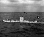 The U.S. Navy bathyscaphe Trieste under tow, en route to a deep water dive in the Pacific on Sept. 15, 1959. Commander Walsh said the vessel flew both the American and Swiss flags to symbolize the joint venture.