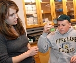 Elizabeth Wiellette, a postdoc associate in the Sive Lab at the MIT-affiliated Whitehead Insitute for Biomedical Research, works with Ryan O'Leary of Holliston High School.