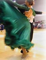 Former MIT Ballroom Dance Team members Reena Freedman and Michael Posner (hidden) show off their winning whirl in the MIT Open Ballroom Dance Competition.
