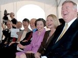 Laughing at the groundbreaking for the McGovern Institute are, seated from left: President Charles M. Vest; Dean of the School of Science Robert J. Silbey; Mrs. Ann Sharp; Phillip A. Sharp, professor of biology and director of the McGovern Institute for Brain Research; Mrs. Rebecca Vest; Lore Harp McGovern, and Patrick McGovern.