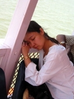 M.B.A. student Jacqui Tan snoozes during the return-trip boat ride from the Elephant Caves in Mumbai, India.