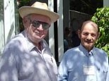 Benoit Mandelbrot (left), the professor of mathematics at Yale University who discovered fractals, chats with MIT Professor Alexander Rich between sessions