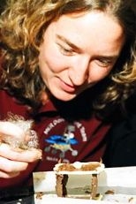 Emily Crapar, an MIT graduate student in aeronautics and astronautics, works on making a tiny chocolate table.