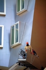 A construction worker puts finishing touches on the nearly completed Stata Center.