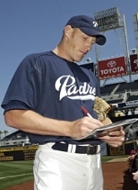 San Diego Padres pitcher and MIT alumnus Jason Szuminski signs  an autograph prior to the Padres' final exhibition  game Sunday, April 4.