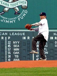 Professor Susumu Tonegawa winds up to throw the ceremonial first pitch at Fenway Park.