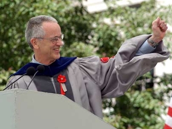 Charles Vest gestures in appreciation to a previous speaker before giving his charge to the graduates at his last Commencement as president of MIT.