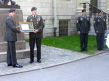 Staff Sergeant Joseph Howell, second from left, receiving his award from Col. J.C. Allard, the First Brigade Commander, at Harvard University prior to June 9th Commissioning Ceremony.