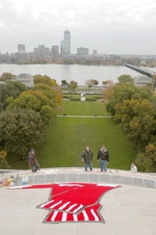 The MIT dome wore its own festive attire for the Red Sox World Series celebration parade Oct. 30. As the sun rose over the dome Oct. 29, two days after the Sox clinched the victory in Game Four, it revealed that the dome had been transformed into a baseball bearing a Red Sox logo. The fabric logo remained until after the parade, when Facilities workers took it down. The Facilities workers in the p...