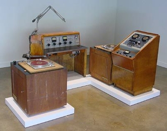 WTBS Radio Station: Console, turntables, reel-to-reel tape and station wall clock.