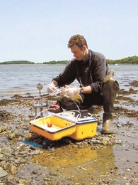 Ranier Lohmann, a former postdoctoral associate at MIT's Parsons Lab, takes samples in Boston Harbor to assess levels of toxic organic compounds.