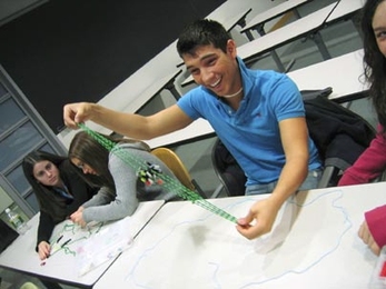 Eleventh-grader Nick Tetreault of Hudson High School examines a model of a mitotic spindle at MIT on March 23. Tetreault was one of dozens of high school biology students who visited the Institute during spring break to see what graduate work in the field is like.