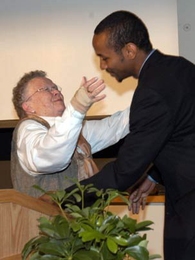 Priscilla Gray hugs John Pope '05, winner of the Priscilla King Gray Award for Public Service, at the Awards Convocation on May 10.