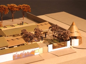 This architectural model of a proposed Community Care Center, made by graduate student Katice Helinski, shows the courtyard, a "microvillage" of buildings and the traditional Zambian insake at the entrance. Children's murals will grace the outer walls. The design is by Professor Jan Wampler, assisted by students Helinski and Stephen Form.