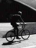 A bicyclist passes by Kresge Auditorium on the MIT campus.