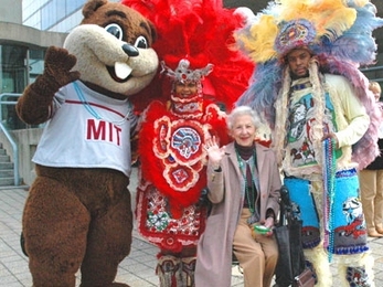 Catherine 'Kay' Stratton, 91, center, joins Tim the Beaver and two members of New Orleans jazz band the Wild Magnolias on Oct. 28. The band played for members of the Council for the Arts at MIT, which was holding its 33rd annual meeting.