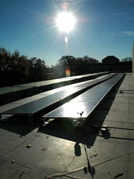 Solar panels on top of the Hayden Memorial Library soak up the afternoon sun on Monday, Nov. 14, the day MIT celebrated the completion of its largest solar installation.