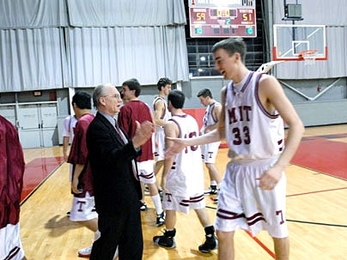 Dean for Undergraduate Research J. Kim Vandiver greets MIT basketball player Willard J. Johnson '09 as he comes off the court on Tuesday, Jan. 24. Vandiver is the team's faculty mentor.