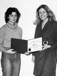 Founding President Barbara Johnston, left, holds the charter certificate for the MIT chapter of the Society of Women Engineers in February 1980. At right is Sheila E. Widnall, who is now an Institute professor.