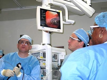 Dr. Raphael Bueno, left, and team use a new MIT technology to shrink a patient's lung tumor by more than 90 percent during laser surgery at Brigham and Women's Hospital.