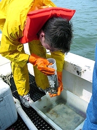 Civil and environmental engineering senior James Vanzo draws water samples from Lake Pontchartrain, which borders New Orleans, during spring break. Vanzo was one of eight undergraduates who conducted research on water quality as part of Laboratory Course 1.107.