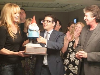 MIT alumnus Edward R. Miller, center, hosts a celebrity poker tournament during his appearance on the television show 'Queer Eye for the Straight Guy.' He is flanked by celebrities Susan Anton and David Brenner in this still from the show, which will air Tuesday, June 20, at 10 p.m.