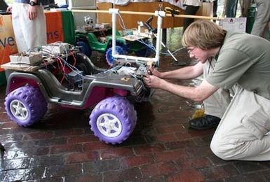 Jonathan Kush of the Alabama School of Mathematics and Science tinkers with his team's anti-mine robot system. To research their project, the nine team members visited the humanitarian demining training center at Fort Leonard Wood, Mo.